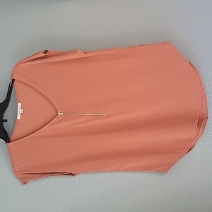 V-neck sleeveles shirt, silver zipper, salmon. Scoop bottom. USA made. MED
